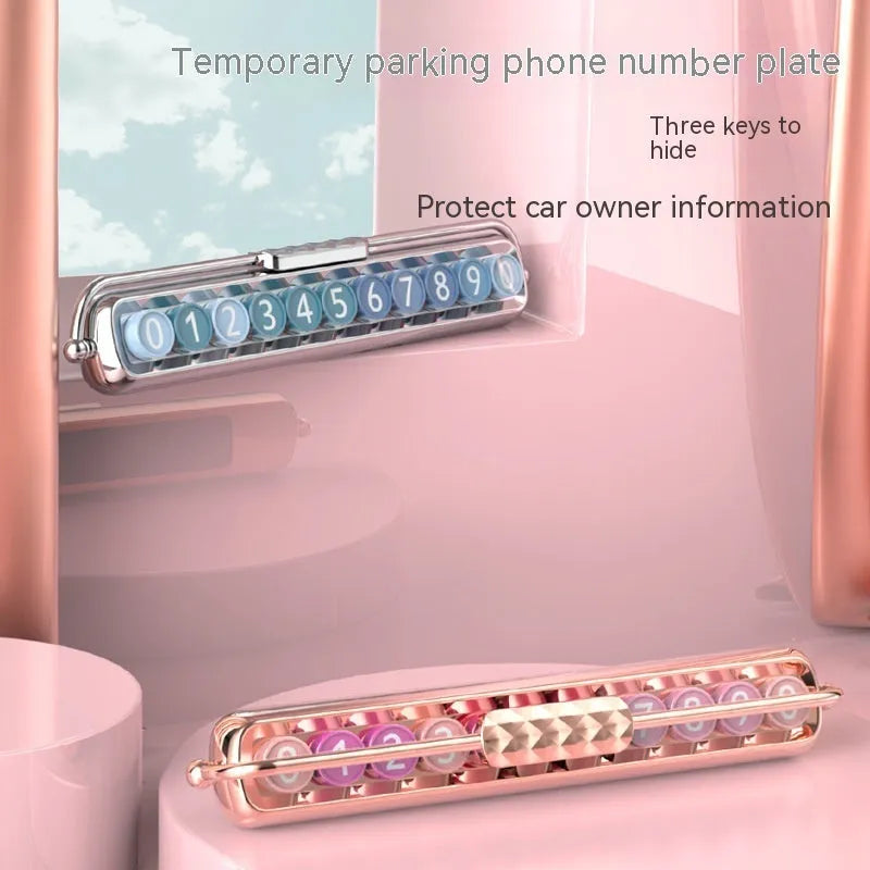 Plastic temporary parking number sign showing colour options: gold background with pink numbers, silver with blue numbers, black with green gradient.