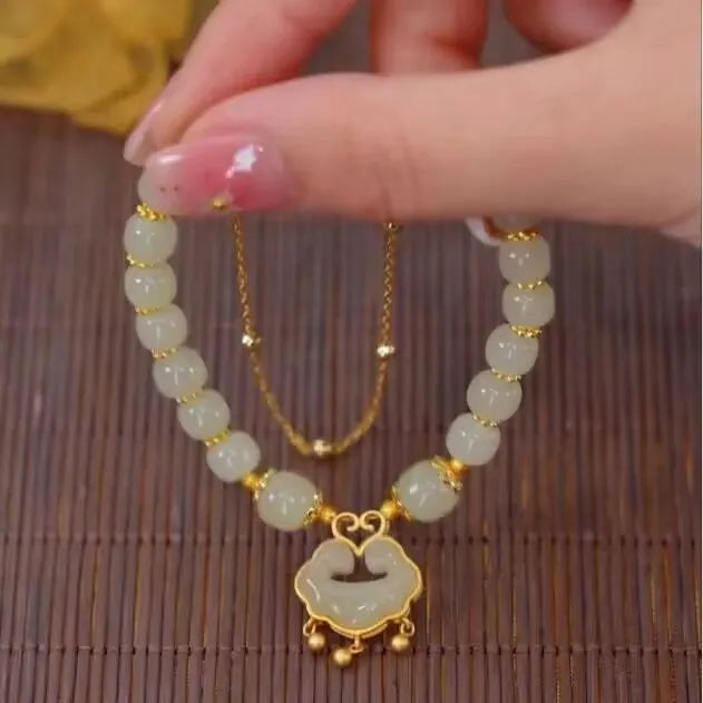 Women's green double-layer bracelet with safety lock pendant in drop shape design