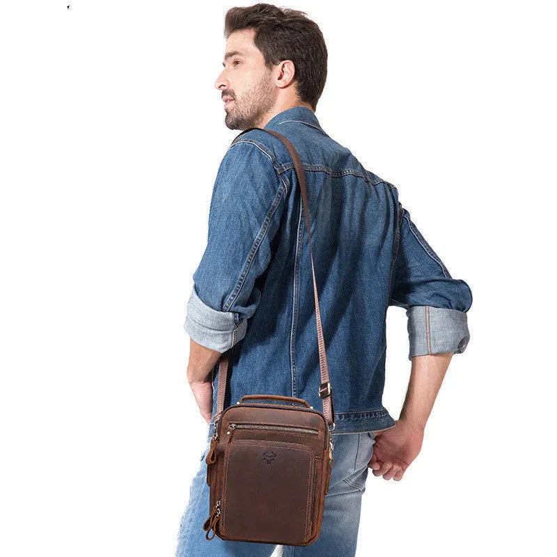 Men's brown Crazy Horse leather crossbody bag with sewing line details and shoulder strap