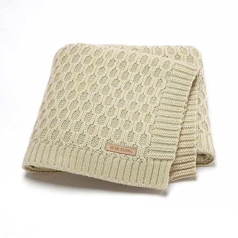 Solid colour acrylic infant hug blanket in light green, showing three-dimensional line texture.