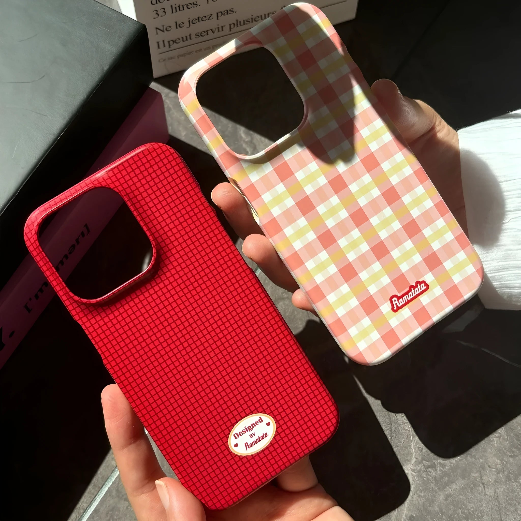 iPhone 15 Pro Max phone case with plaid design in red or orange grid pattern