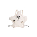 Women's soft PU leather mini backpack messenger bag in black showing crossbody strap