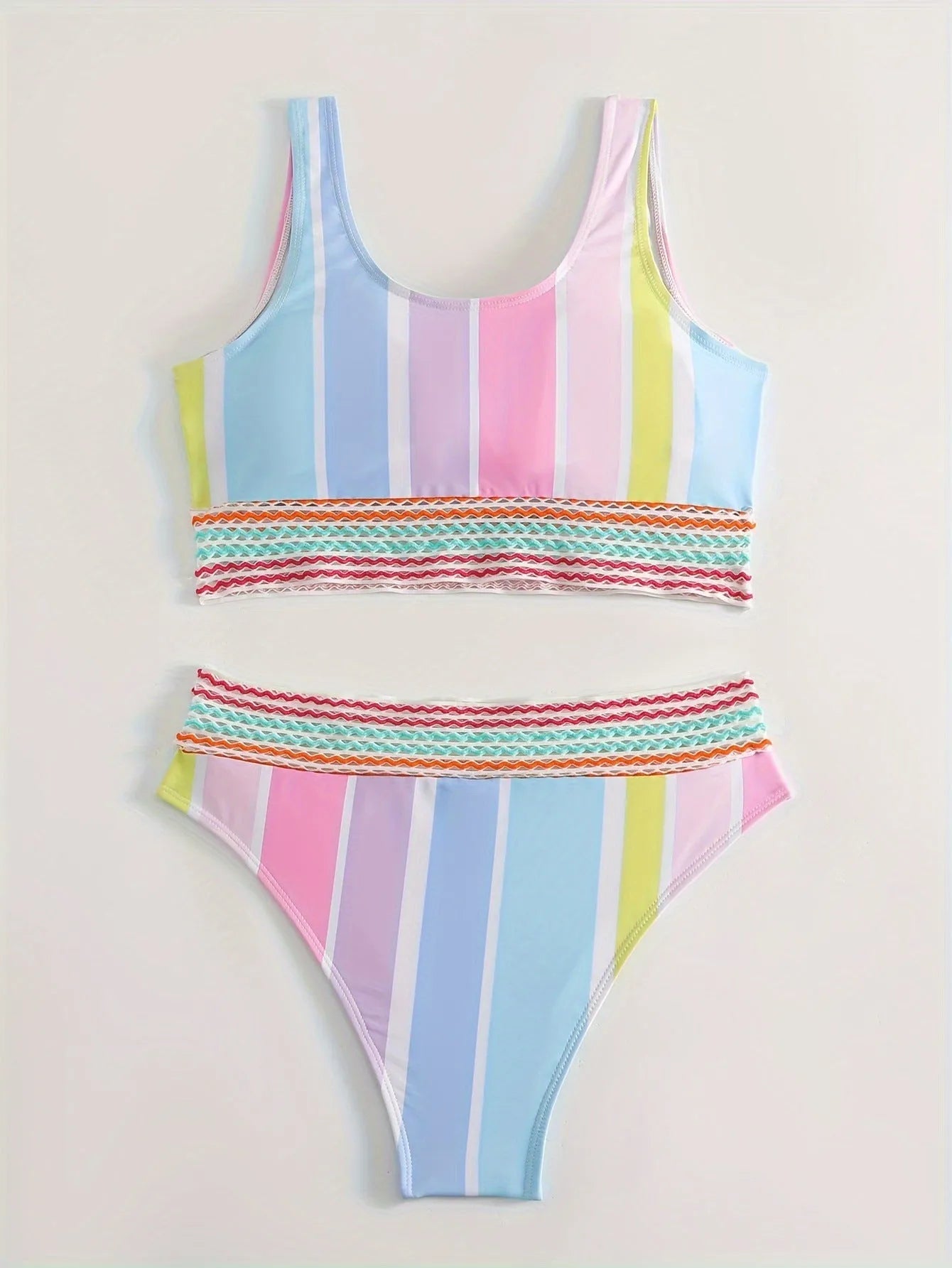 Women's striped sports bikini top and pants set on a mannequin.