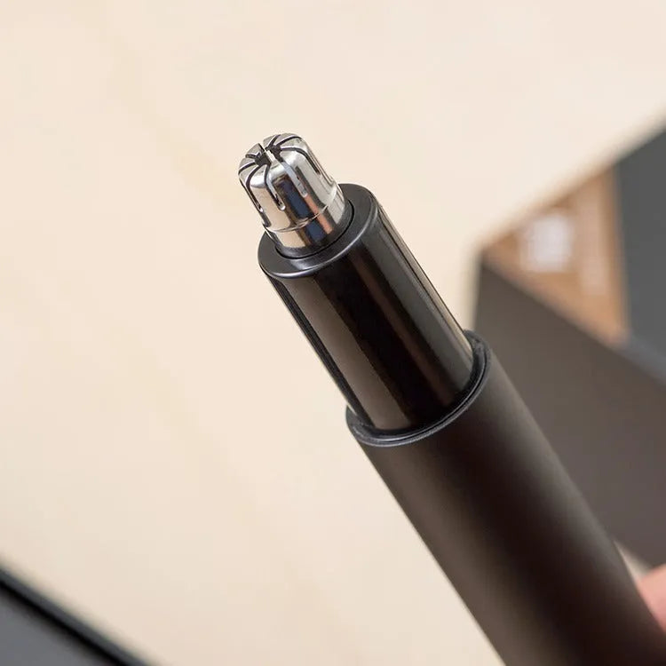 Black electric nose hair trimmer with battery power, fully washable ABS construction, for men and women
