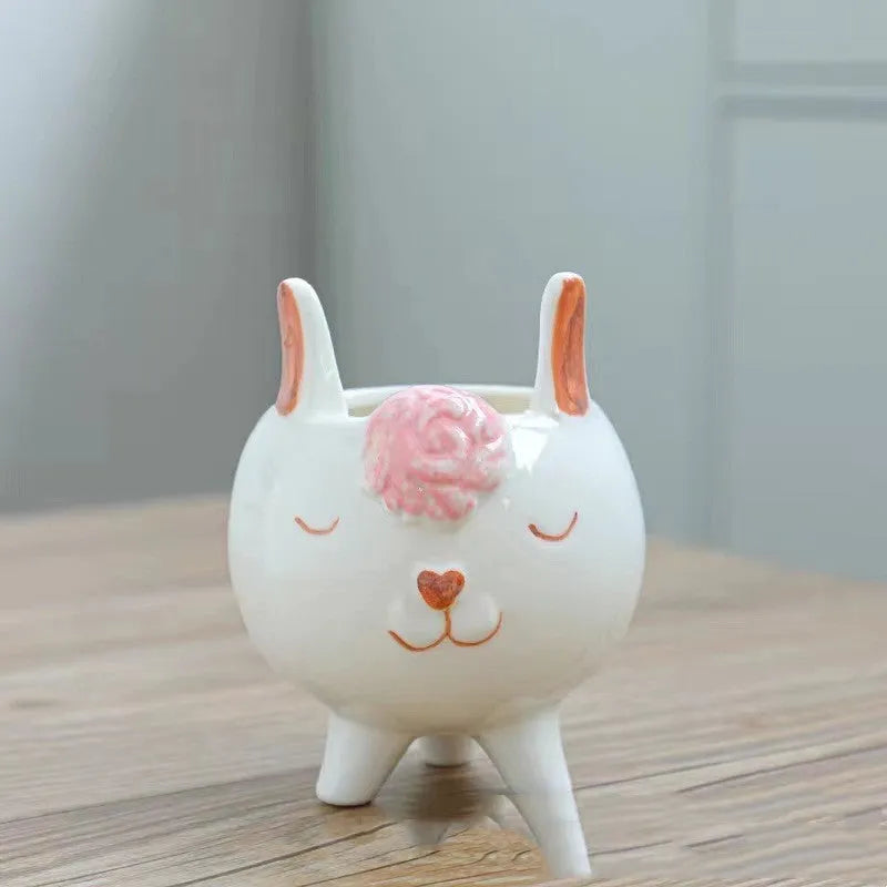 Ceramic succulent flowerpot with hand-painted cartoon animal and floral design in a pastoral style.