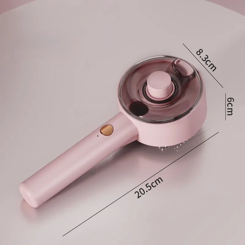 Pink and white cat grooming brush with water tank, stainless steel bristles, and mist spray function
