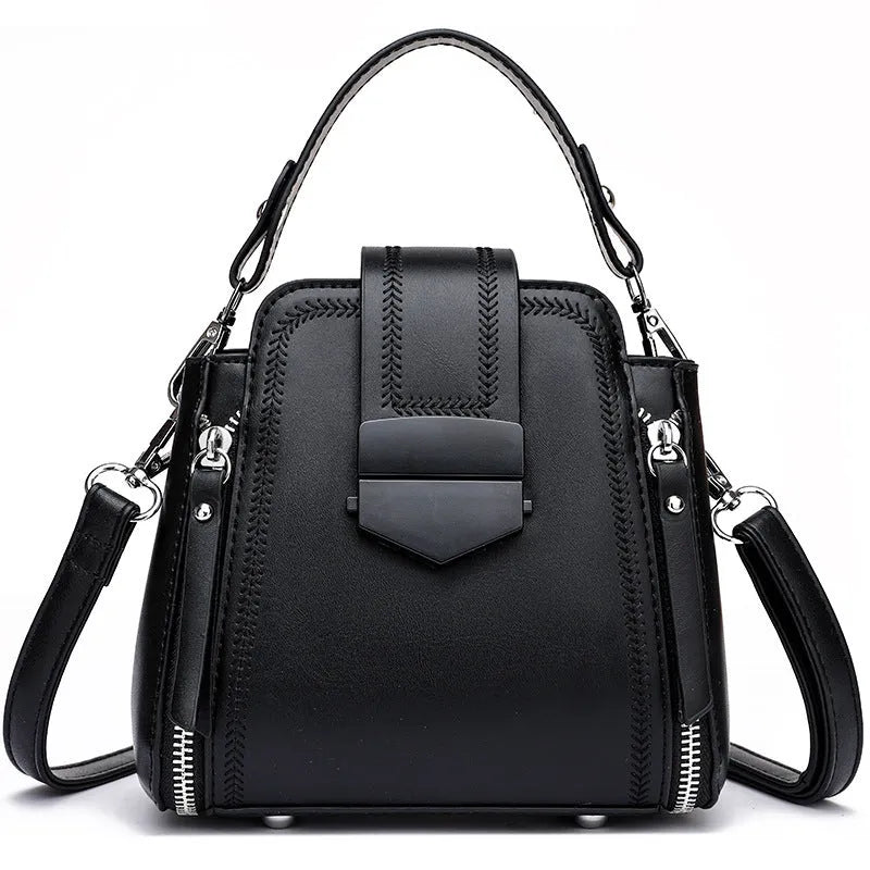 Small square vertical handbag in soft PU leather with textured stitching, shown in multiple colour options.