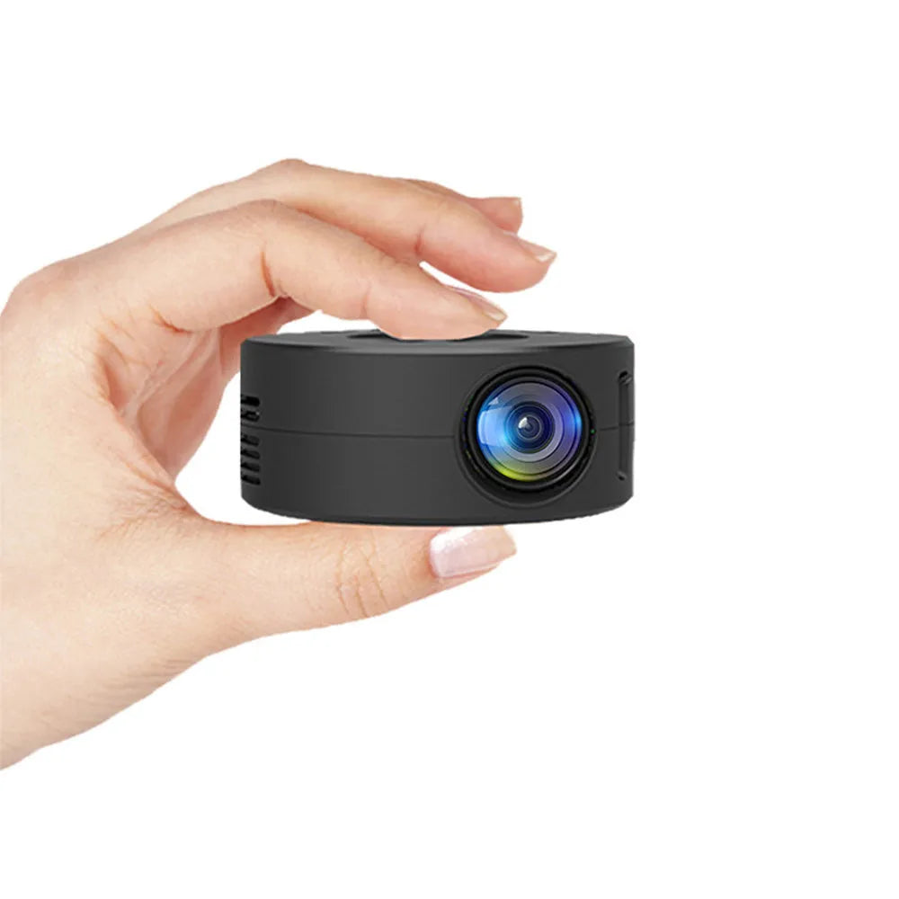 Black mini portable children's projector for mobile phone connection.