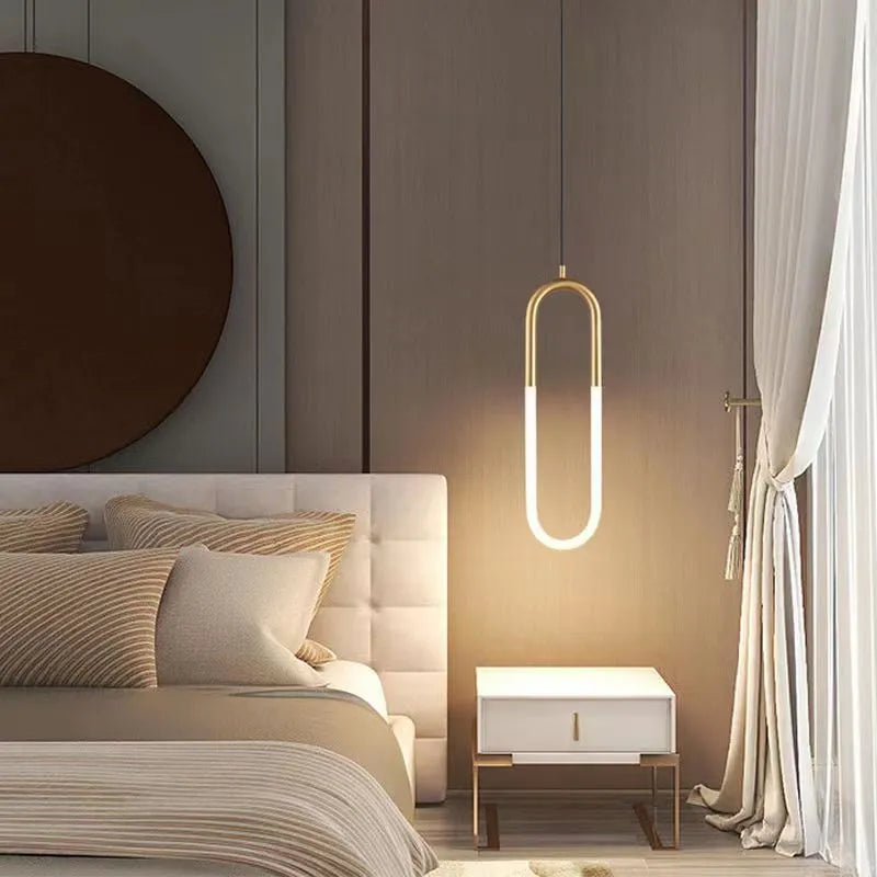 Nordic minimalist U-shaped metal bedside chandelier pendant light in a neutral colour.