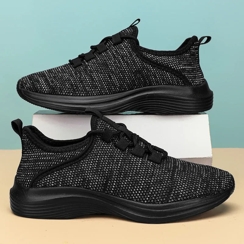 Women's low-top casual sneaker in grey mesh with a round toe and lace-up front.