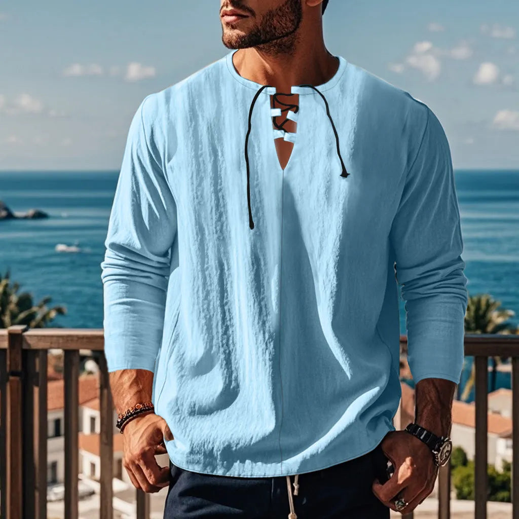 Solid colour cotton linen beach ruff shirt in a loose pullover style.
