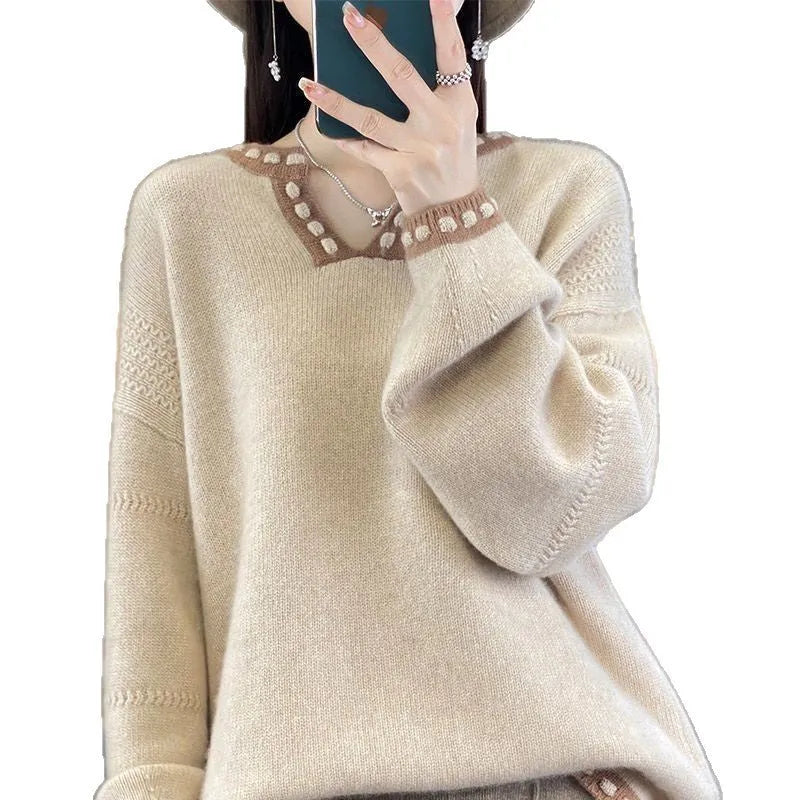 Women's camel coloured V-neck long sleeve viscose pullover sweater on a hanger.
