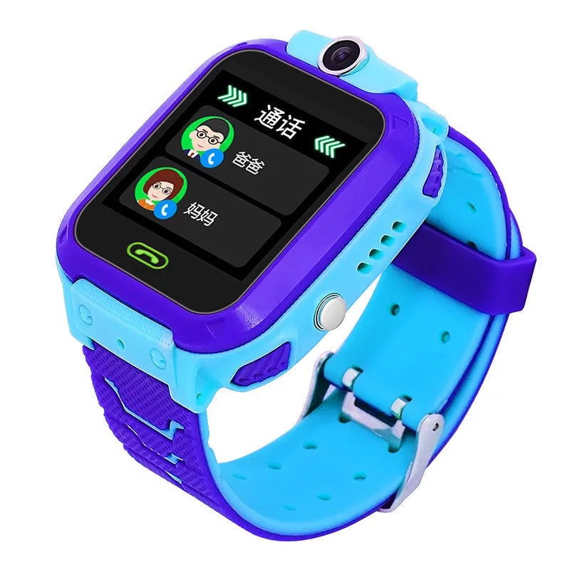Blue children's waterproof smartwatch with a colour touch screen and silicone strap on a wrist.