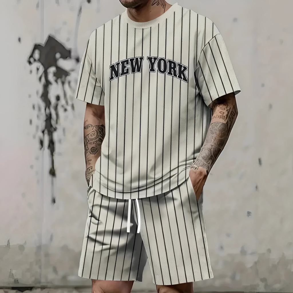 Men's grey 3D printed letter short sleeve top and matching shorts sportswear set laid flat.