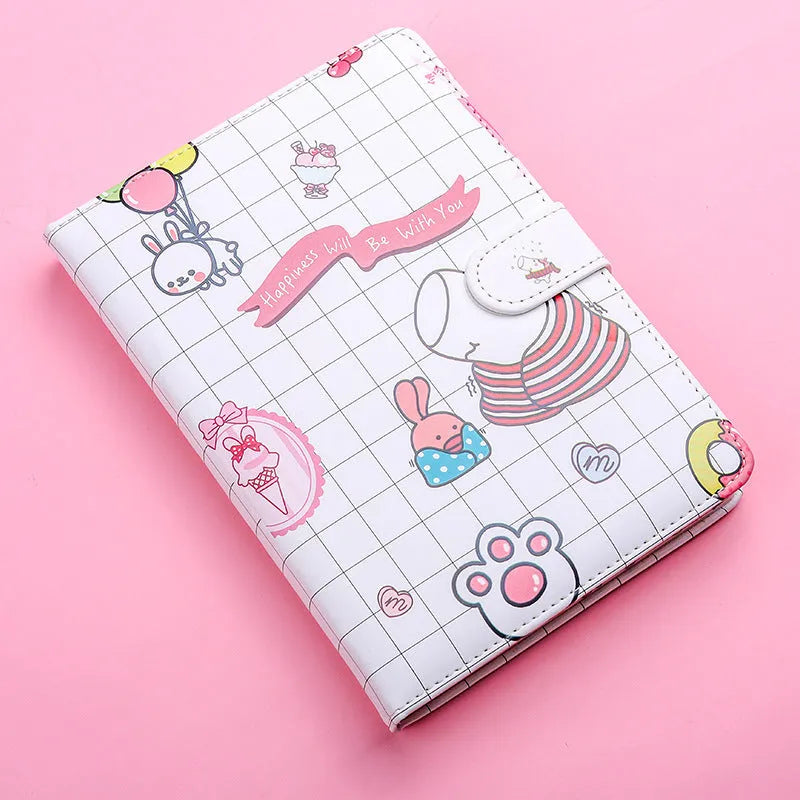 White Kaba Bear Hippo A6 notebook with magnetic buckle and heart design, showing size next to a pen.