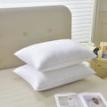 White cotton satin stripe feather pillow showing three size options and loft variations