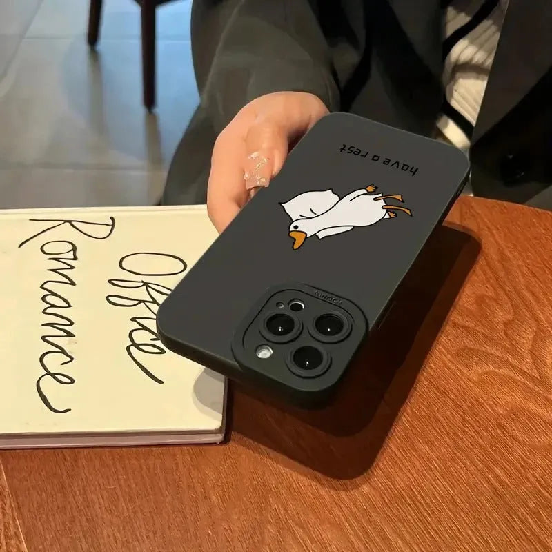 Cute carved cartoon duck design on a black silicone case for an iPhone.