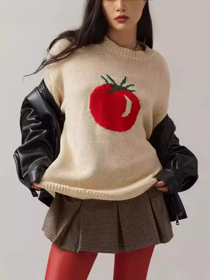 Women's beige acrylic jacquard loose-fitting pullover sweater with round neck and long sleeves.