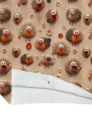 Loose fit digital printed polyester top with lapel collar, shown on a hanger, representing custom print design.