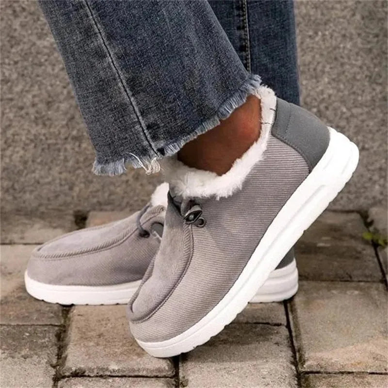 Women's warm plush ankle snow boots with cotton upper cross straps flat heel front tie in black