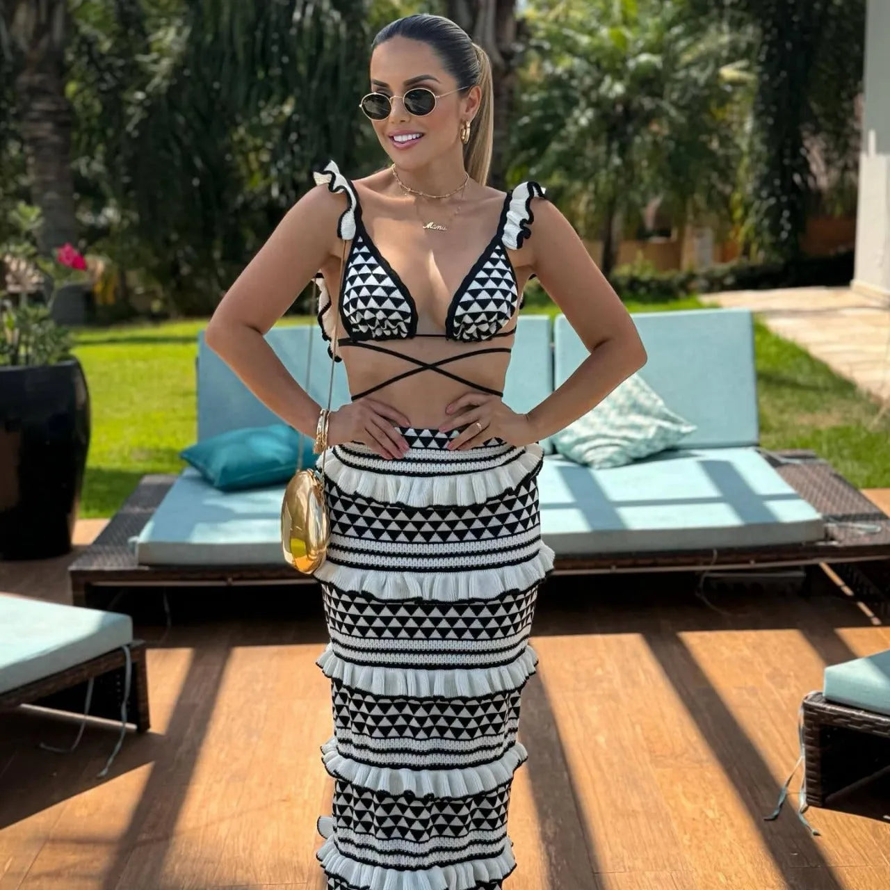 Black and white striped women's bikini set with ruffled straps and long knitted skirt
