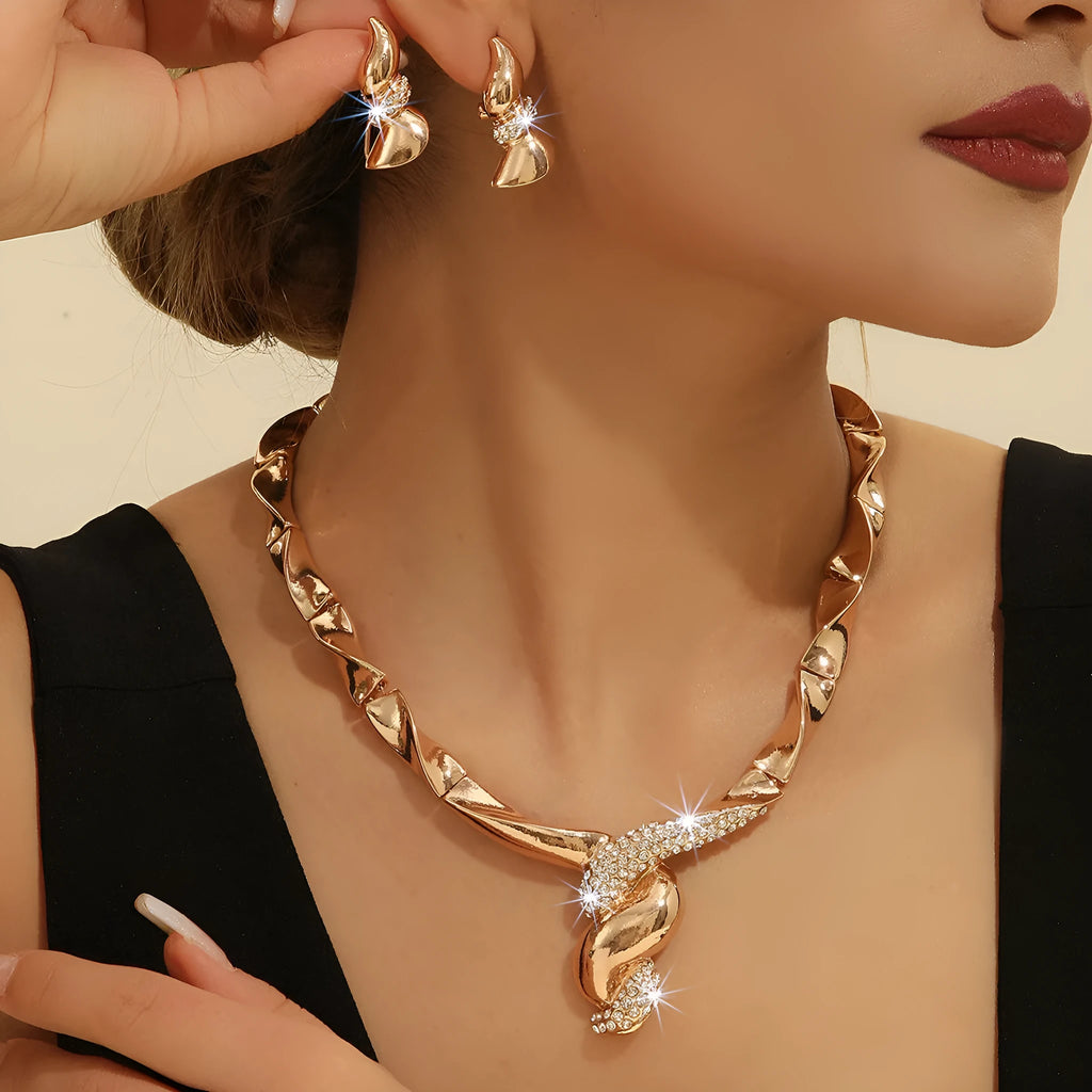 Gold alloy thread necklace and earrings suite with love heart pattern on a white background
