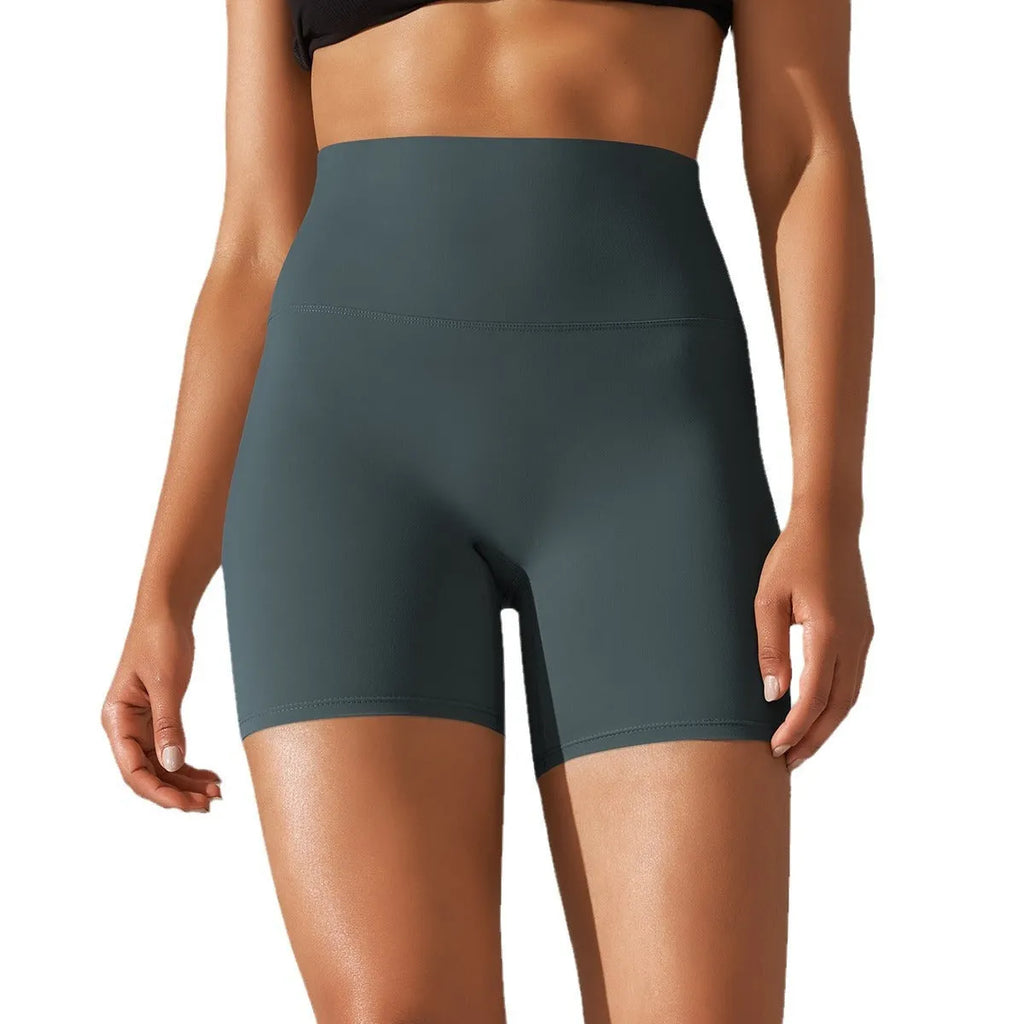 Women's high waist fitness tights in dark green, hip-length cut, for running and gym wear.