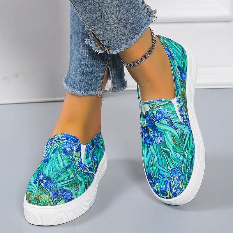 Women's low-top canvas slip-on sneaker in multiple colours, showing flat rubber sole and slip-on design.