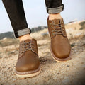 Men's black and brown waterproof mid-top boots with non-slip rubber soles