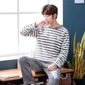 Long sleeve padded flannel pajama suit in cotton with round neck, blue colour, set includes top and trousers for winter sleepwear.