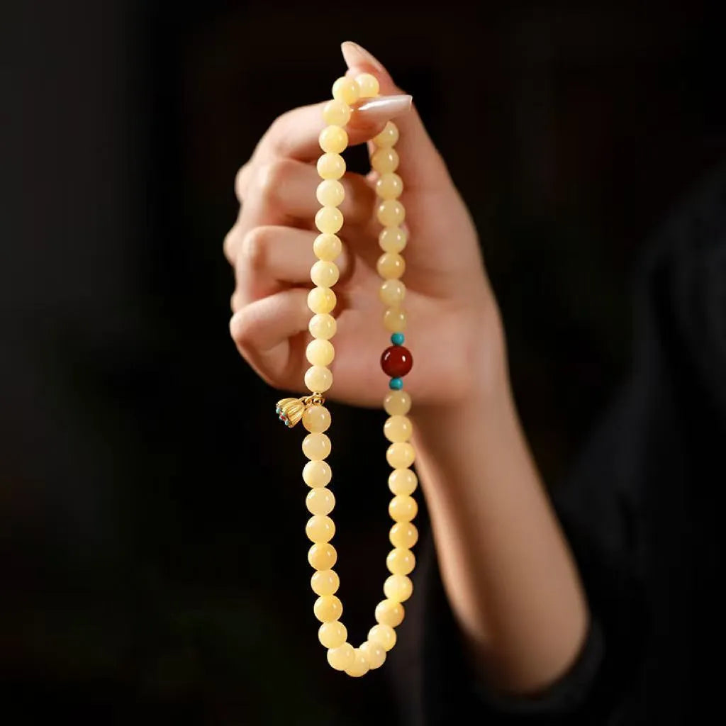 Handmade yellow jade bracelet with double ring design and lotus seedpod shapes