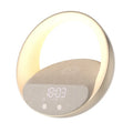 Beige multifunctional bedside unit with wireless charging pad, Bluetooth speaker, and LED light on a wooden table.