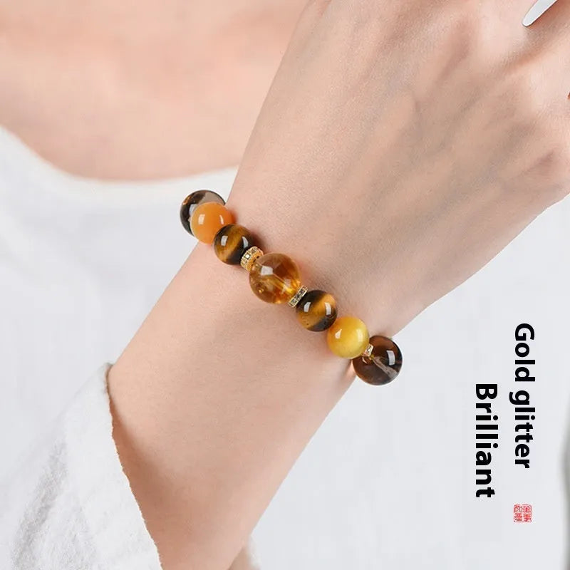 Close-up of a natural yellow artificial crystal bead bracelet with 10mm tower-shaped beads on a string.
