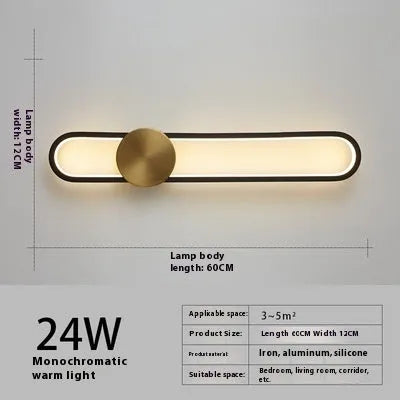 Round minimalist iron wall lamp with warm white LED light in black or gold finish.