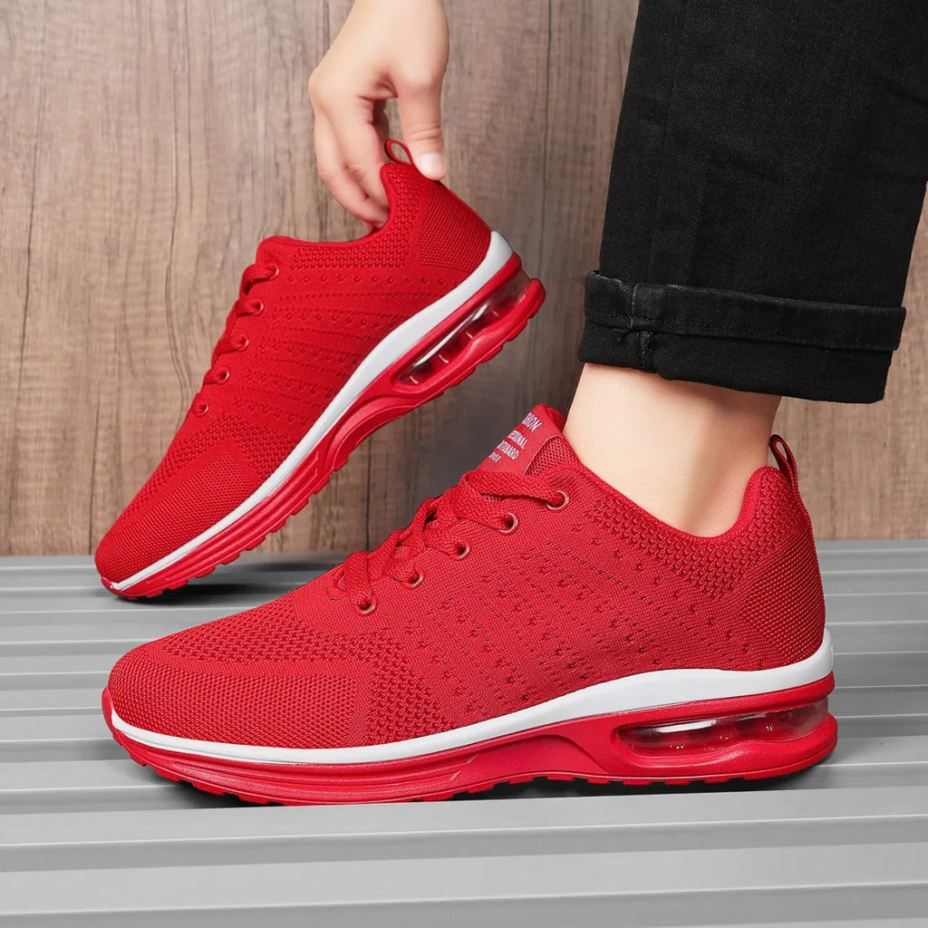 Casual Flyknit running shoes in a colour option, showing mesh upper and round toe design.