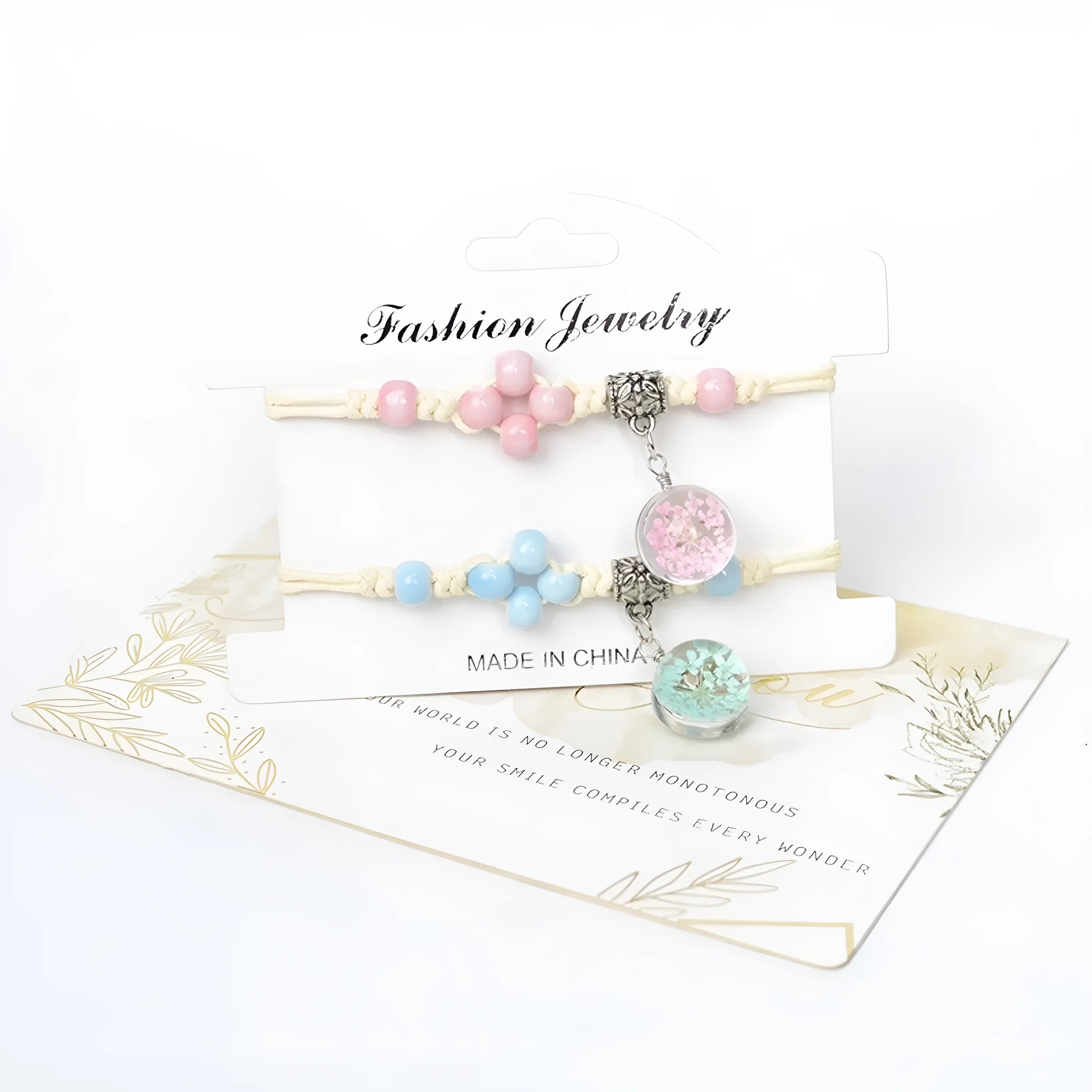 Hand-woven glass bracelet with large beads containing dried flowers and lace decorations, shown in blue.