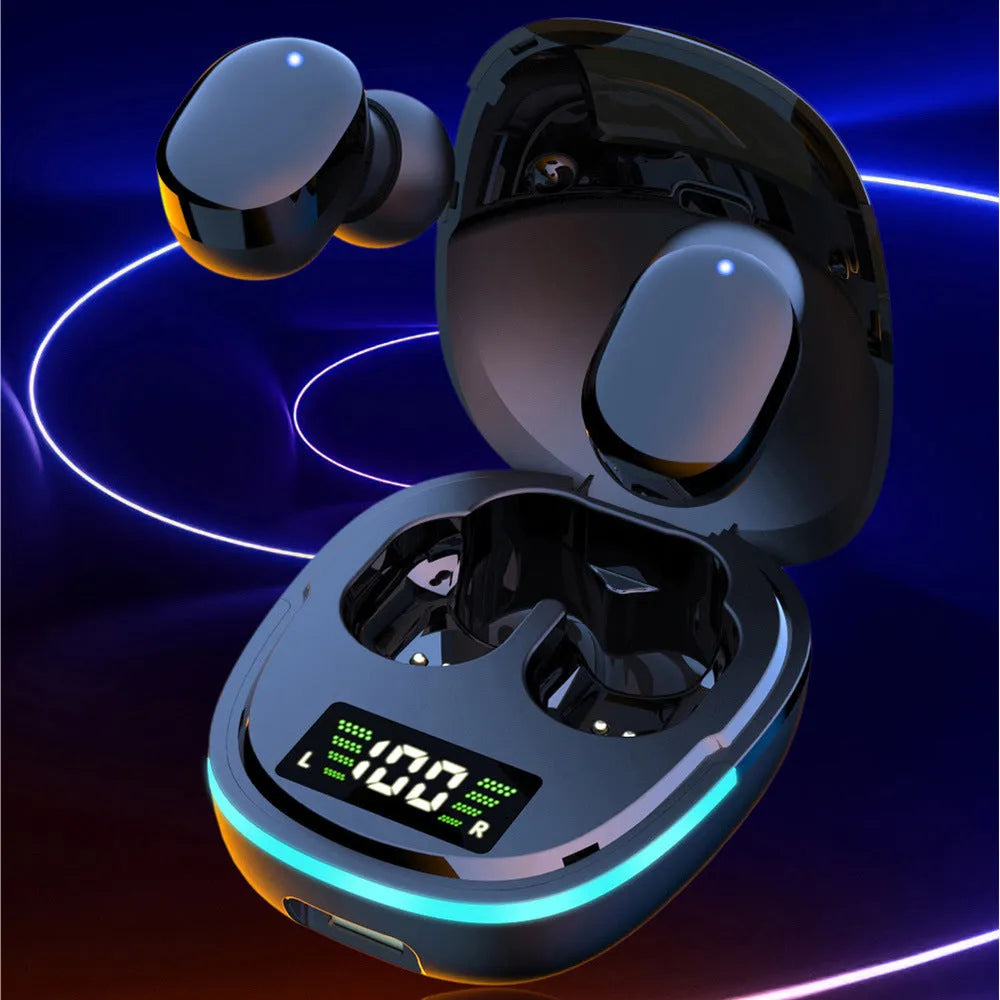 Black wireless Bluetooth in-ear headphones and magnetic charging case on a table.