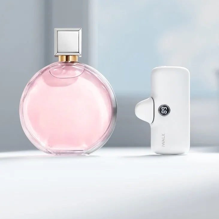 Compact white lipstick-shaped power bank showing screen display and charging port.