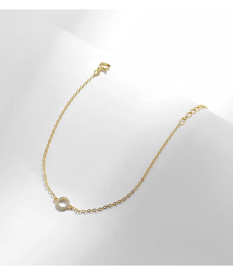 S925 sterling silver women's mini circle bracelet in gold colour with geometric round shape and micro-setting detail