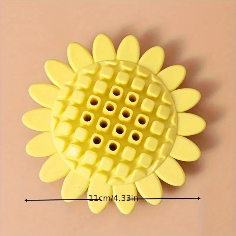 Yellow sunflower-shaped rubber dog chew toy with squeaker