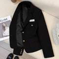 Black loose-fit women's short suit coat with long sleeves and pockets on a hanger.