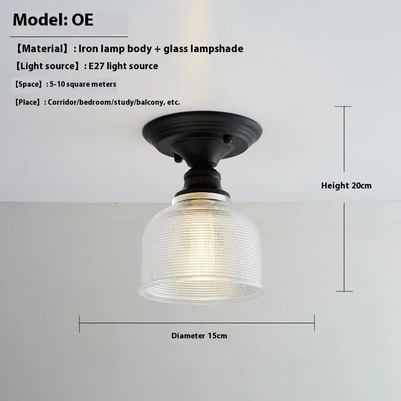 American retro style single-head ceiling or wall lamp with a glass cover.