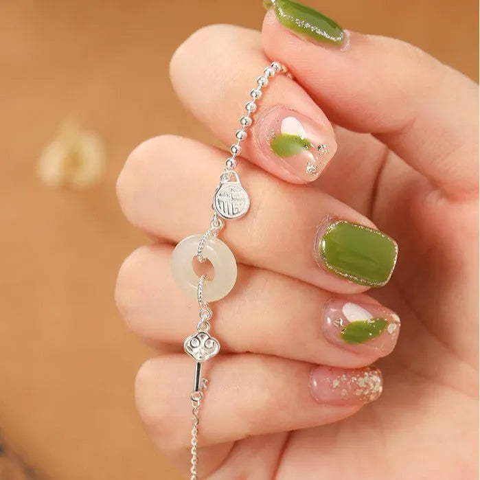 Women's Hetian jade bracelet with 925 silver peace buckle charm in traditional Chinese design