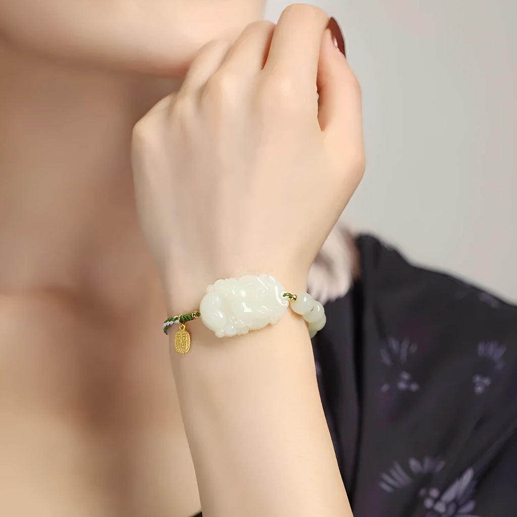 Hetian jade rabbit zodiac bracelet with S925 silver charm on red ice cotton rope