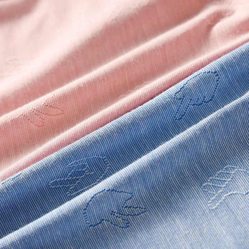 Women's low-waist modal briefs in jacquard knit, showing colour options: dark grey, green, sky blue, pink, and colourful blue.