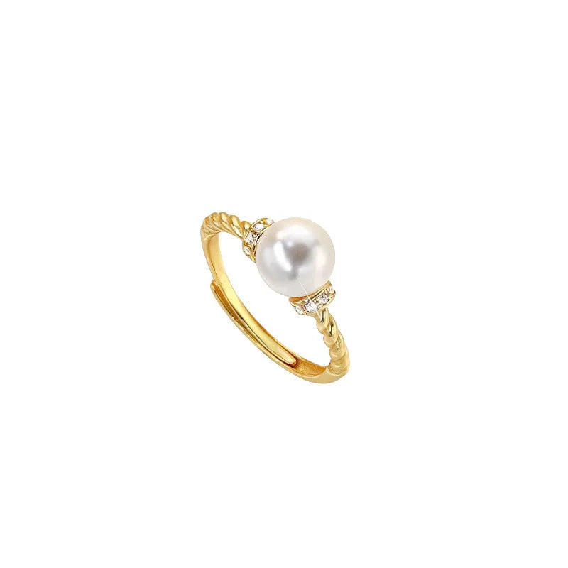 Adjustable copper ring with pearl inlay in gold or silver finish and antique twist design.