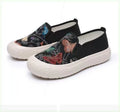 Women's slip-on canvas shoes in Black with round toe and decorative sewing thread details