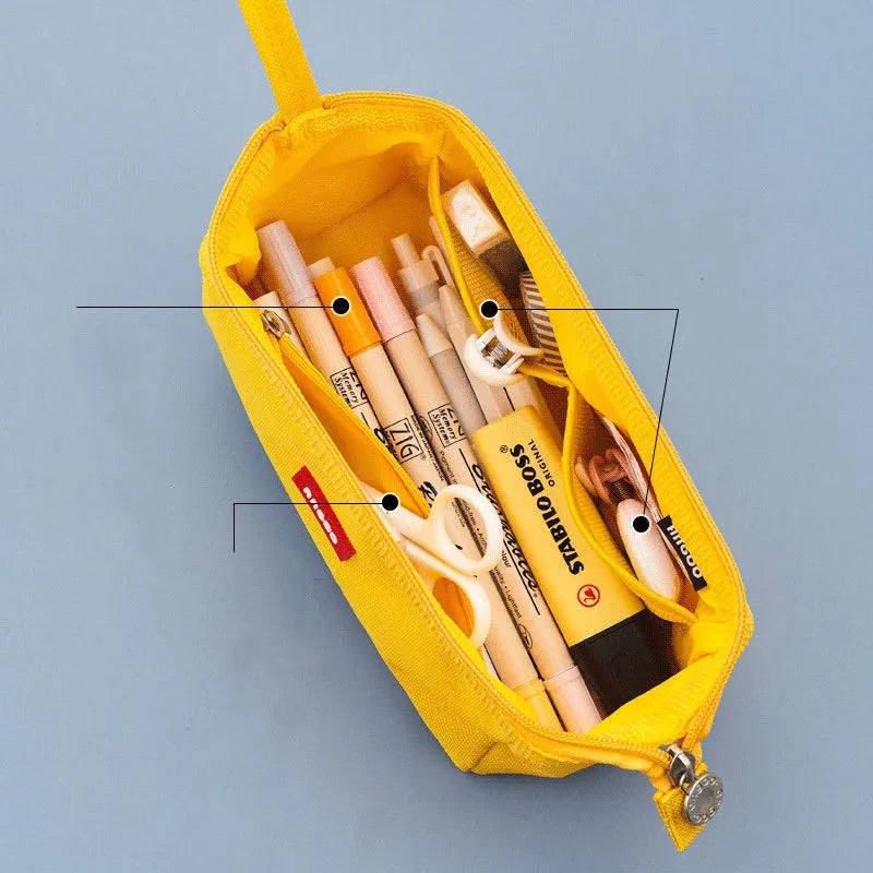 Large Oxford cloth pencil case with double zipper open, showing spacious interior, in yellow colour.