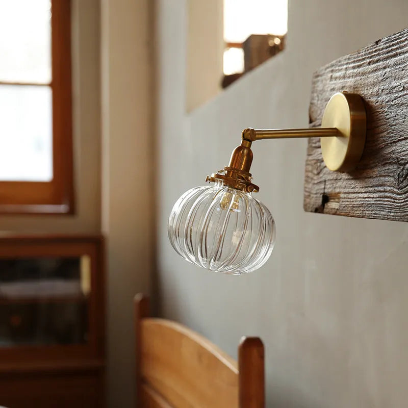 Pumpkin-shaped glass wall lamp in blue and transparent water ripple glass finishes.