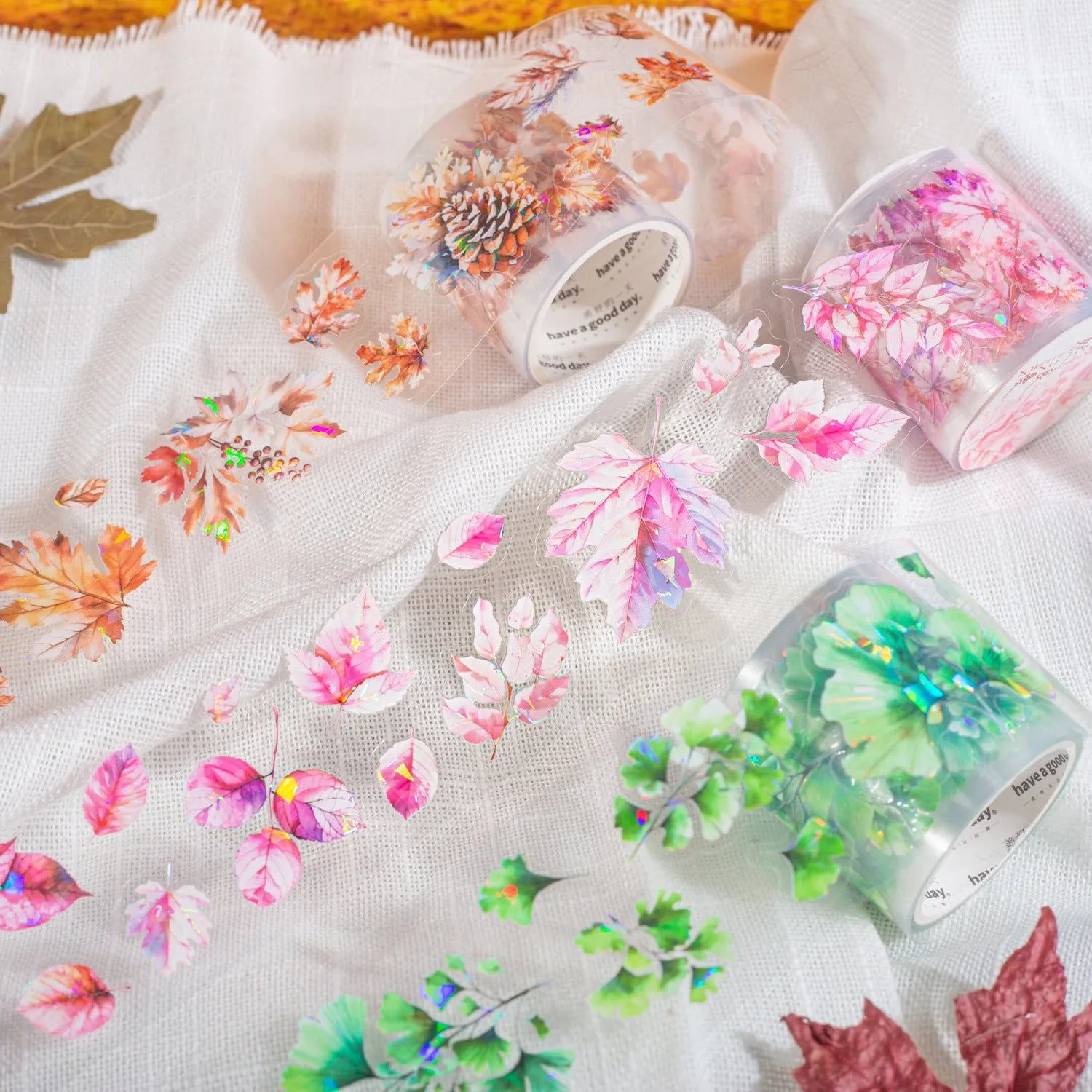 Roll of PET decorative stickers showing six leaf designs including ginkgo and maple, 40mm wide and 2m long.
